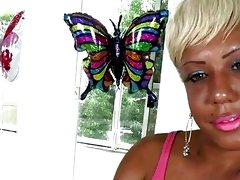 Short-haired ebony shemale chick jerks off her big black cock