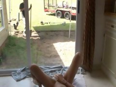 Kinky flatmate masturbates in front of a gardener