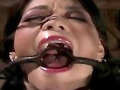 Caged and gagged slut can endure hard pain BDSM porn