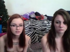 Redhead and brunette lesbians make out