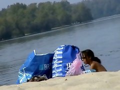 Hidden cams at the beach get two sexy naked Latina babes
