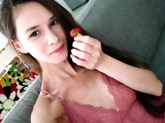 Young beauty Victoria is eating strawberry and masturbating pussy
